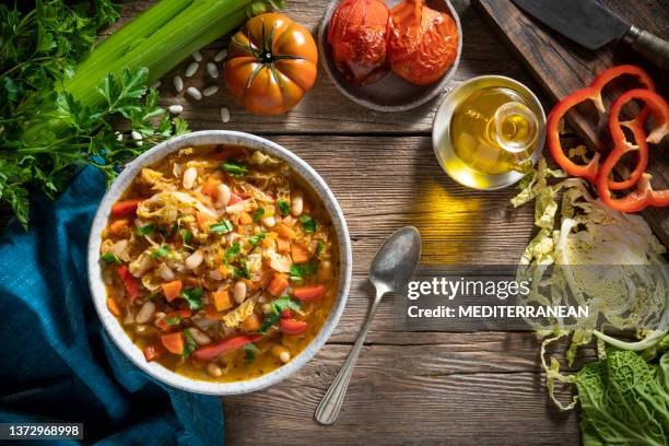 vegetable cabbage soup vegan ingredients celery, beans, bell pepper, carrots, parsley and tomatoes - stew stock pictures, royalty-free photos & images