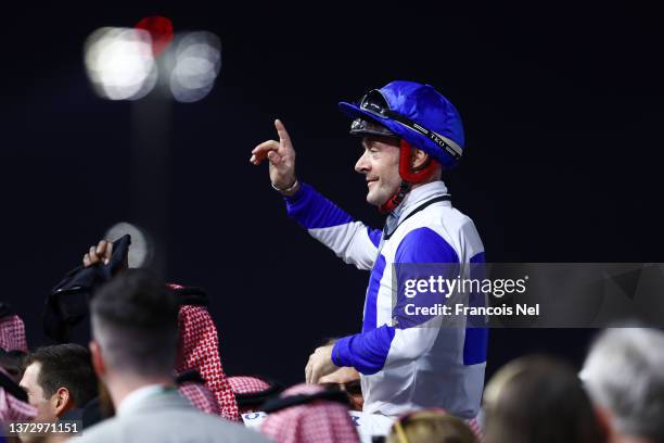 Olivier Peslier riding Hadi De Carrere celebrates after winning The Obaiya Arabian Classic Presented By Lexus race during The Saudi Cup 2022 at King...