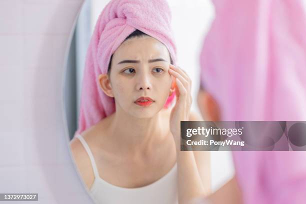 woman look mirror feel upset - tired eyes stock pictures, royalty-free photos & images
