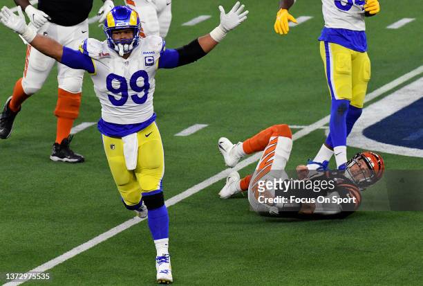 Aaron Donald of the Los Angeles Rams celebrates after sacking quarterback Joe Burrow of the Cincinnati Bengals in the second half during Super Bowl...