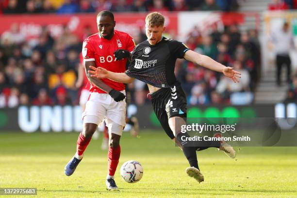 Robbie Cundy of Bristol City battle for possession with Keinan Davis of Nottingham Forest during the Sky Bet Championship match between Nottingham...