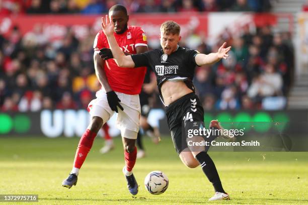 Robbie Cundy of Bristol City battle for possession with Keinan Davis of Nottingham Forest during the Sky Bet Championship match between Nottingham...