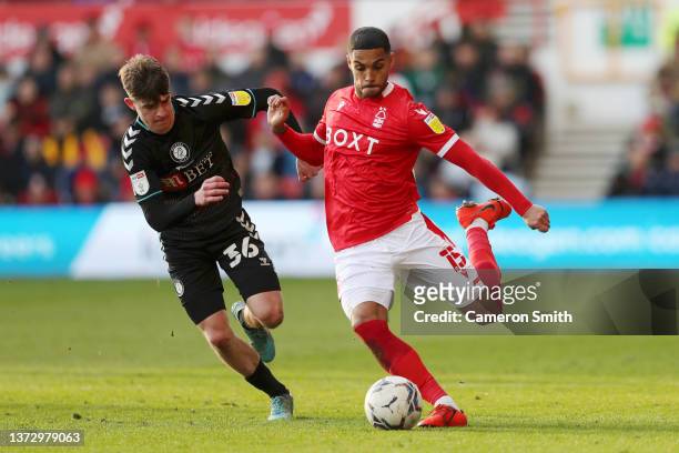 Max Lowe of Nottingham Forest under pressure from Alex Scott of Bristol City during the Sky Bet Championship match between Nottingham Forest and...