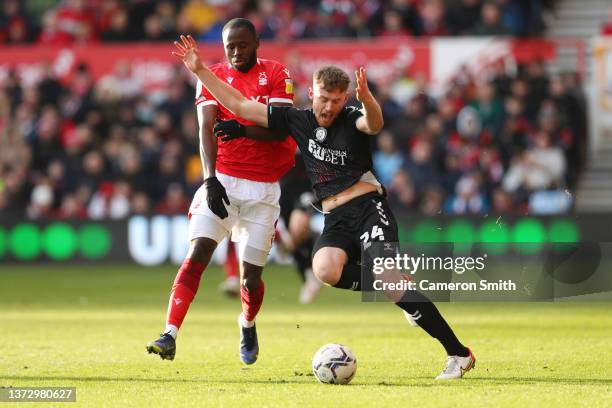 Robbie Cundy of Bristol City battles for possession with Keinan Davis of Nottingham Forest during the Sky Bet Championship match between Nottingham...