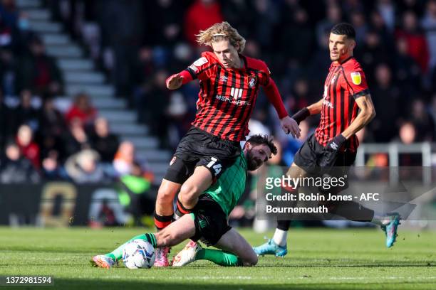 Joe Allen of Stoke City fouls Todd Cantwell of Bournemouth during the Sky Bet Championship match between AFC Bournemouth and Stoke City at Vitality...