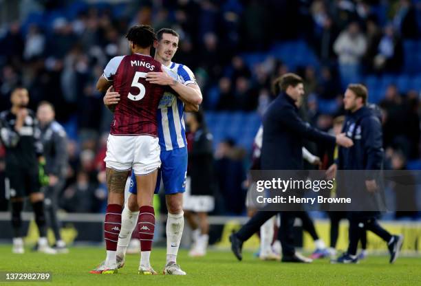 Tyrone Mings of Aston Villa embraces Lewis Dunk of Brighton & Hove Albion after the Premier League match between Brighton & Hove Albion and Aston...