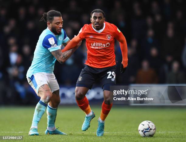 Amari'i Bell of Luton Town holds off Colin Kazim-Richards of Derby County during the Sky Bet Championship match between Luton Town and Derby County...