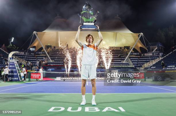 Andrey Rublev of Russia holds the trophy after defeating Jiri Vesely of Czech Republic in the Men's final on day 13 of the Dubai Duty Free Tennis at...