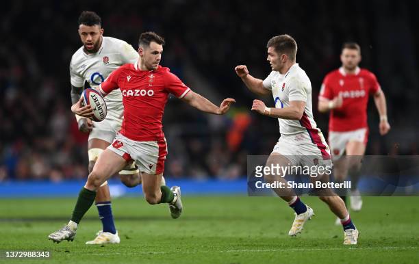 Tomos Williams of Wales fends off Harry Randall of England during the Guinness Six Nations Rugby match between England and Wales at Twickenham...