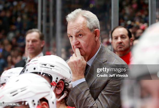 Head coach Darryl Sutter of the Calgary Flames looks on from the bench during their NHL game against the Vancouver Canucks at Rogers Arena February...