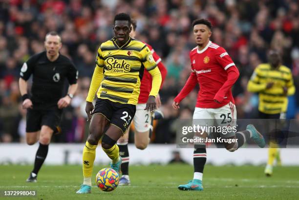 Ismaila Sarr of Watford controls the ball during the Premier League match between Manchester United and Watford at Old Trafford on February 26, 2022...