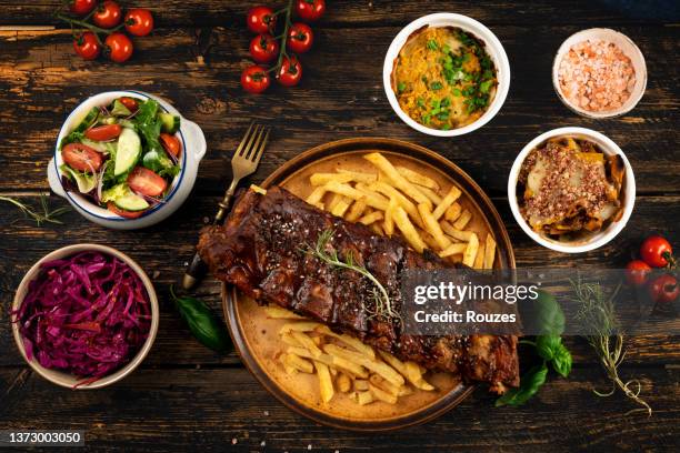 barbecue spareribs and french fries - smoked bbq ribs stock pictures, royalty-free photos & images