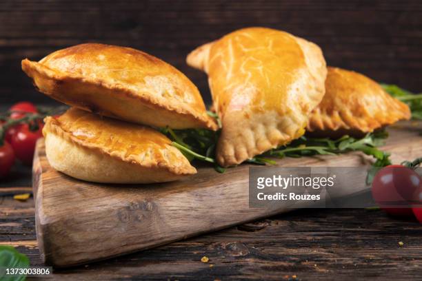 pasties filled with meat and vegetables - calzone stock pictures, royalty-free photos & images