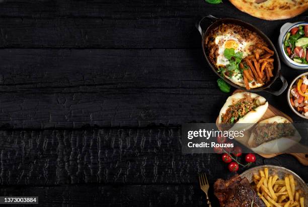 tasty food table - restaurant background stock pictures, royalty-free photos & images