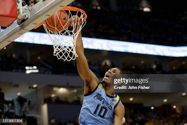 Justin Lewis of the Marquette Golden Eagles scores on a slam dunk during the second half of the game against the Butler Bulldogs at Fiserv Forum on...