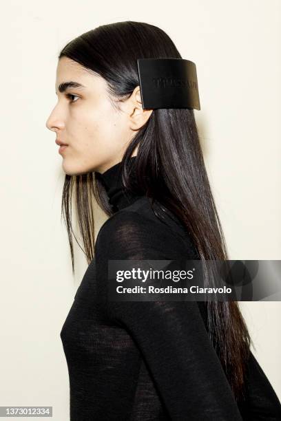Model, hair detail, poses backstage of the Trussardi fashion show during the Milan Fashion Week Fall/Winter 2022/2023 on February 26, 2022 in Milan,...