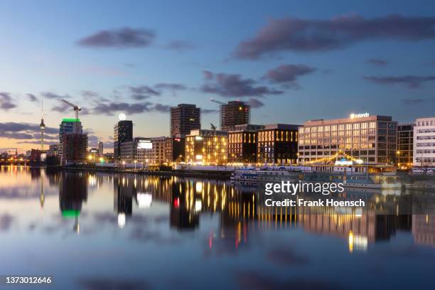 View across the Spree to buildings and ships in Berlin, Germany, on February 16, 2022.