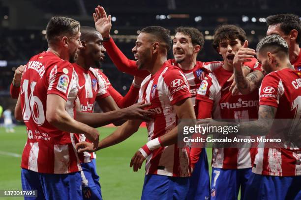 Renan Lodi of Atletico de Madrid celebrates scoring their second goal with teammates Hector Herrera , Geoffrey Kondogbia , Sime Vrsaljko , Joao Felix...
