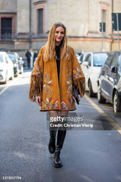 Olivia Palermo seen wearing brown jacket with fringes, black dress, black over knee boots outside Etro fashion show during the Milan Fashion Week...