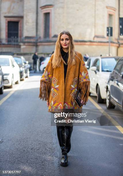 Olivia Palermo seen wearing brown jacket with fringes, black dress, black over knee boots outside Etro fashion show during the Milan Fashion Week...