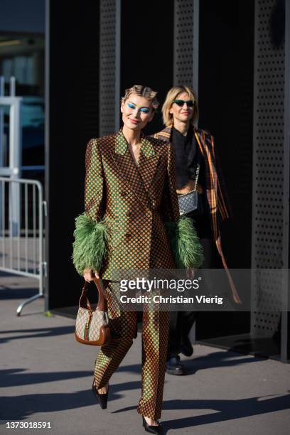 Amalie Gassmann seen wearing brown blazer & pants, bag outside Gucci fashion show during the Milan Fashion Week Fall/Winter 2022/2023 on February 25,...
