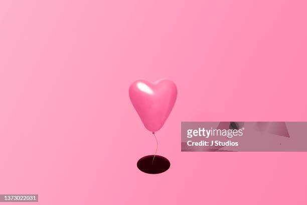 Pink heart ballon on a string