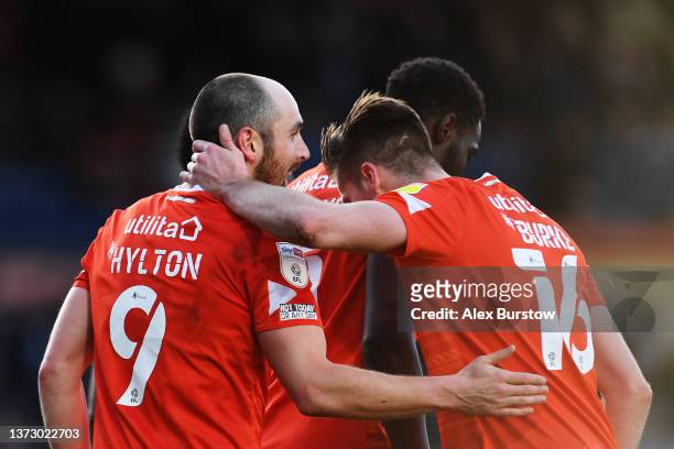 Danny Hylton of Luton Town is congratulated by teammate Reece Burke after scoring their team's first goal during the Sky Bet Championship match...