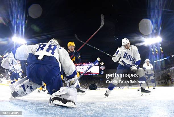 Tanner Jeannot of the Nashville Predators puts the rebound of a shot into the net for a goal past goaltender Andrei Vasilevskiy of the Tampa Bay...