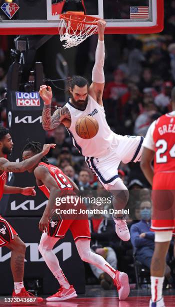 Steven Adams of the Memphis Grizzlies dunks over Ayo Dosunmu of the Chicago Bulls at the United Center on February 26, 2022 in Chicago, Illinois....