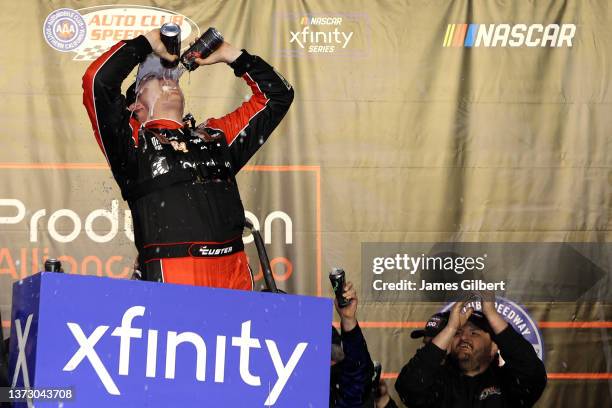 Cole Custer, driver of the Production Alliance Group Ford, celebrates in the Ruoff Mortgage victory lane after winning the NASCAR Xfinity Series...