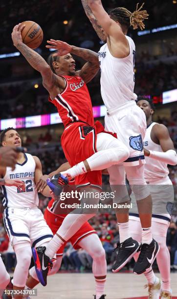 DeMar DeRozan of the Chicago Bulls shoots against Brandon Clarke of the Memphis Grizzlies at the United Center on February 26, 2022 in Chicago,...