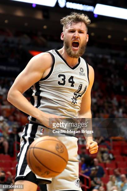 Jock Landale of the San Antonio Spurs reacts after dunking during the first quarter against the Miami Heat at FTX Arena on February 26, 2022 in...