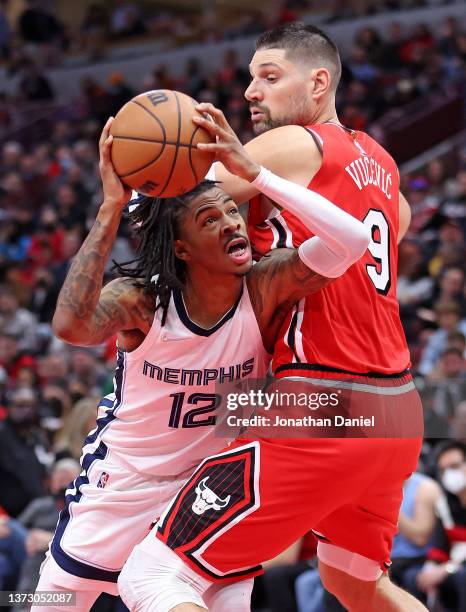 Ja Morant of the Memphis Grizzlies drives against Nikola Vucevic of the Chicago Bulls on his way to a game-high 46 points at the United Center on...