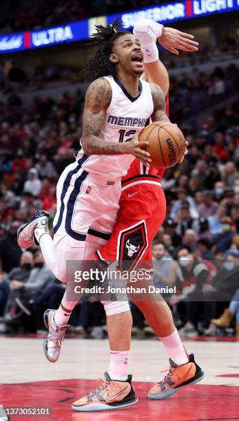 Ja Morant of the Memphis Grizzlies drives to the basket against Nikola Vucevic of the Chicago Bulls on his way to a game-high 46 points at the United...