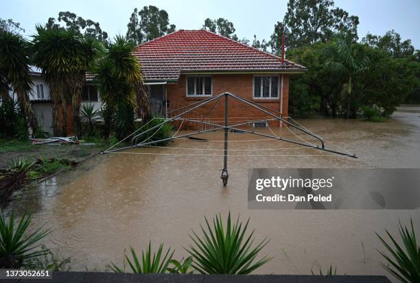 House is inundated by flood water on February 27, 2022 in Goodna, west of Brisbane, Australia. Parts of South-East Queensland are experiencing the...