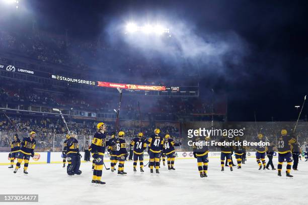Nashville Predators players react after the 2022 Navy Federal Credit Union NHL Stadium Series between the Tampa Bay Lightning and the Nashville...