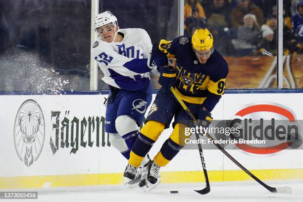 Matt Duchene of the Nashville Predators and Cal Foote of the Tampa Bay Lightning battle for the puck in the third period during the 2022 Navy Federal...