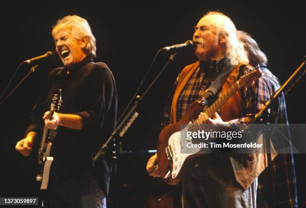 Graham Nash and David Crosby of Crosby, Stills, Nash & Young perform at San Jose Arena on February 4, 2000 in San Jose, California.