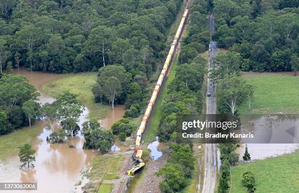 In an aerial view, a train is derailed in an accident caused by flooding in the town of Gympie on February 27, 2022 in an area north of Sunshine...