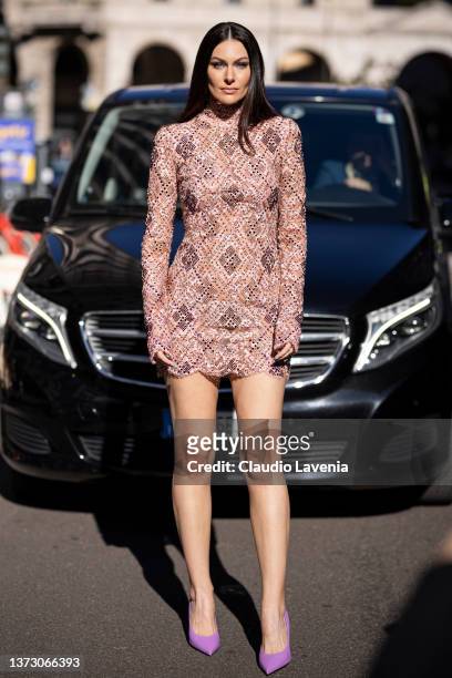 Paola Turani poses ahead of the Ermanno Scervino fashion show wearing nude print pattern long sleeves dress during the Milan Fashion Week Fall/Winter...