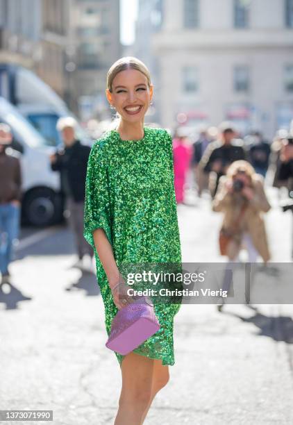 Leonie Hanne seen weairng green glitter dress, pink bag, heels outside Ermanno Scervino fashion show during the Milan Fashion Week Fall/Winter...