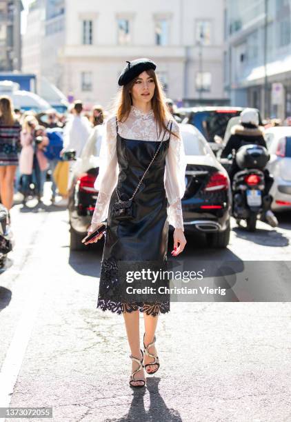 Mara Lafontan seen wearing beret, laced white blouse, black dress, Chanel bag, heels outside Ermanno Scervino fashion show during the Milan Fashion...