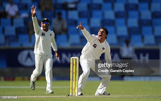 Saeed Ajmal of Pakistan unsuccessfully appeals during the first Test match between Pakistan and England at The Dubai International Cricket Stadium on...