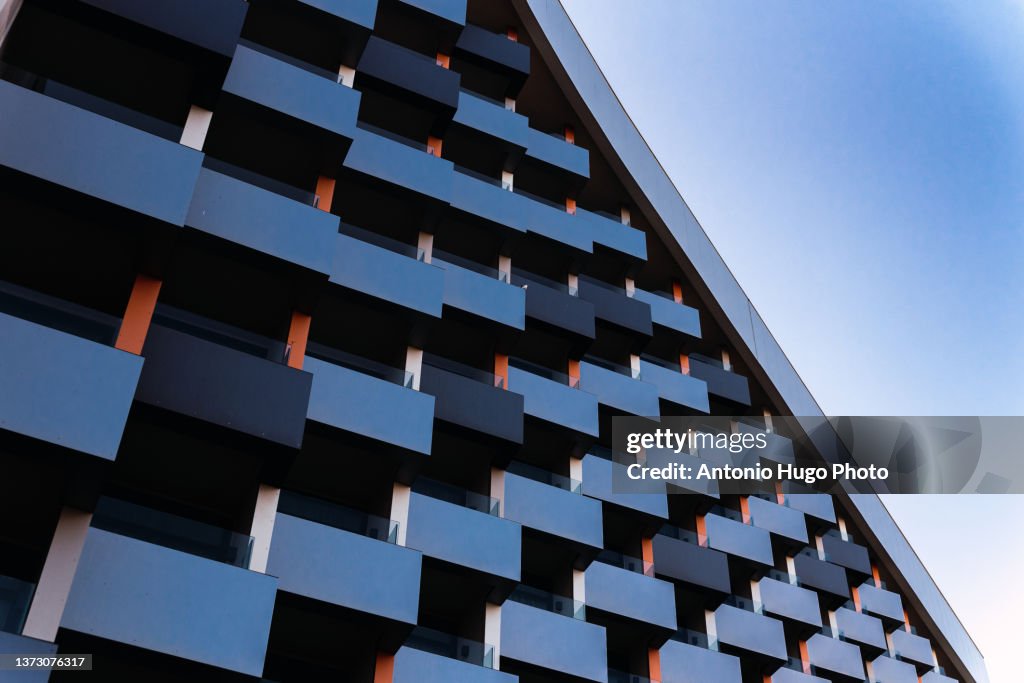 Modern building with square balconies seen from below. Modern architecture.