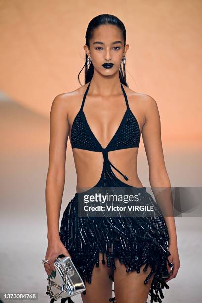 Model walks the runway during the Ambush Ready to Wear Fall/Winter 2022-2023 fashion show as part of the Milan Fashion Week on February 26, 2022 in...