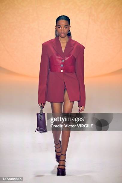 Model walks the runway during the Ambush Ready to Wear Fall/Winter 2022-2023 fashion show as part of the Milan Fashion Week on February 26, 2022 in...