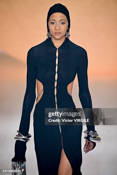 Model walks the runway during the Ambush Ready to Wear Fall/Winter 2022-2023 fashion show as part of the Milan Fashion Week on February 26, 2022 in...