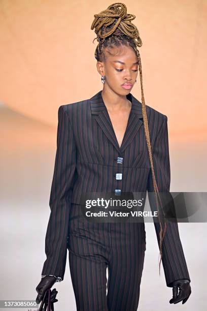 Model walks the runway during the Ambush Ready to Wear Fall/Winter 2022-2023 fashion show as part of the Milan Fashion Week on February 26, 2022 in...