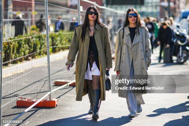 Guest wears black sunglasses, silver chain necklaces, a gold chain necklace, a black blazer jacket, a black V-neck t-shirt, a navy blue long blazer...