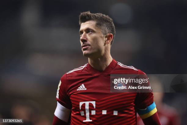 Robert Lewandowski of Muenchen wears an additional armband in the colours of the Ukrainian flag during the Bundesliga match between Eintracht...